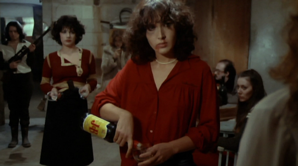 Kadın Kadına Karşı (Le evase, 1978) filminde Lilli Carrati firari militan Monica rolünde